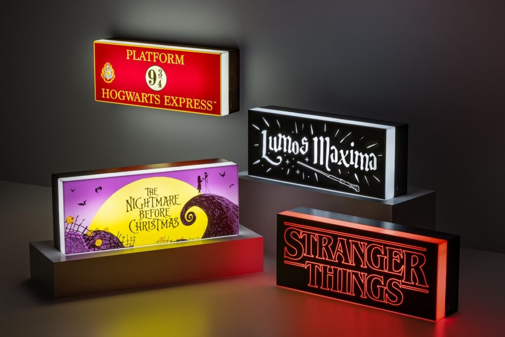 A collection of Paladone Logo Lights. Featuring two Harry Potter lights, a Nightmare Before Christmas logo light, and a Stranger Things logo light.