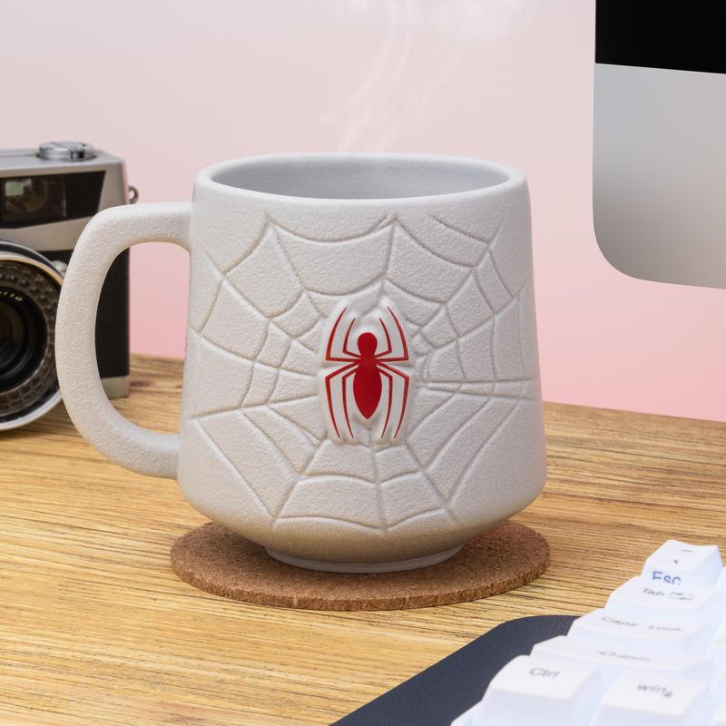 Paladone's Marvel Spider-Man Logo Mug is shown beside a computer and camera.